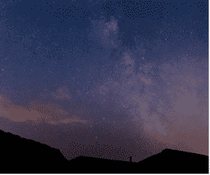 The silhouette of rooftops is seen under a purple sky containing stars and the milky way formation.