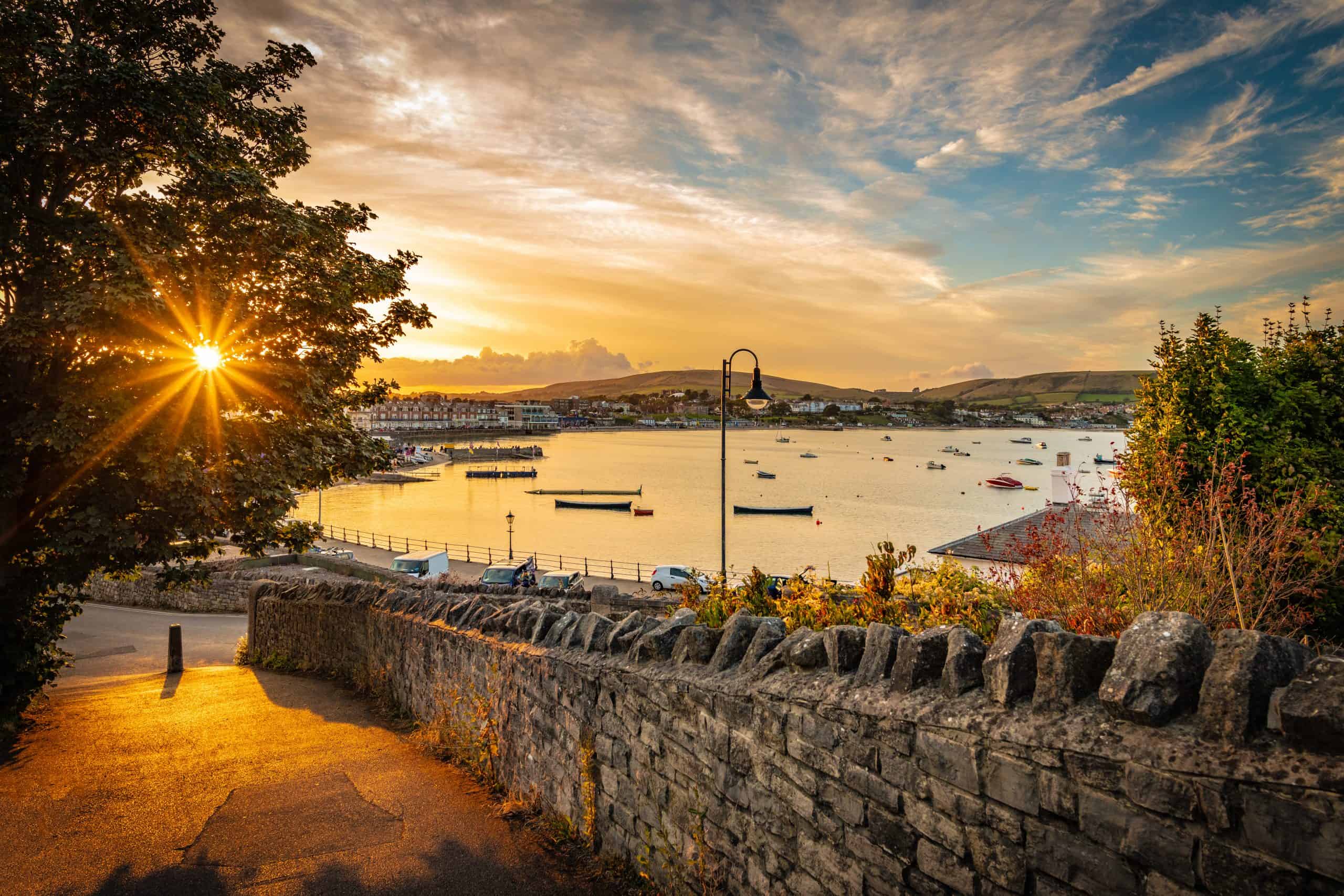 Sunset Over Swanage Harbour In Dorset Burnbake