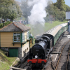 Steam locomotive travels through Swanage railway station, Dorset.