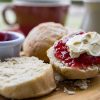 Cream tea with jam and scones.